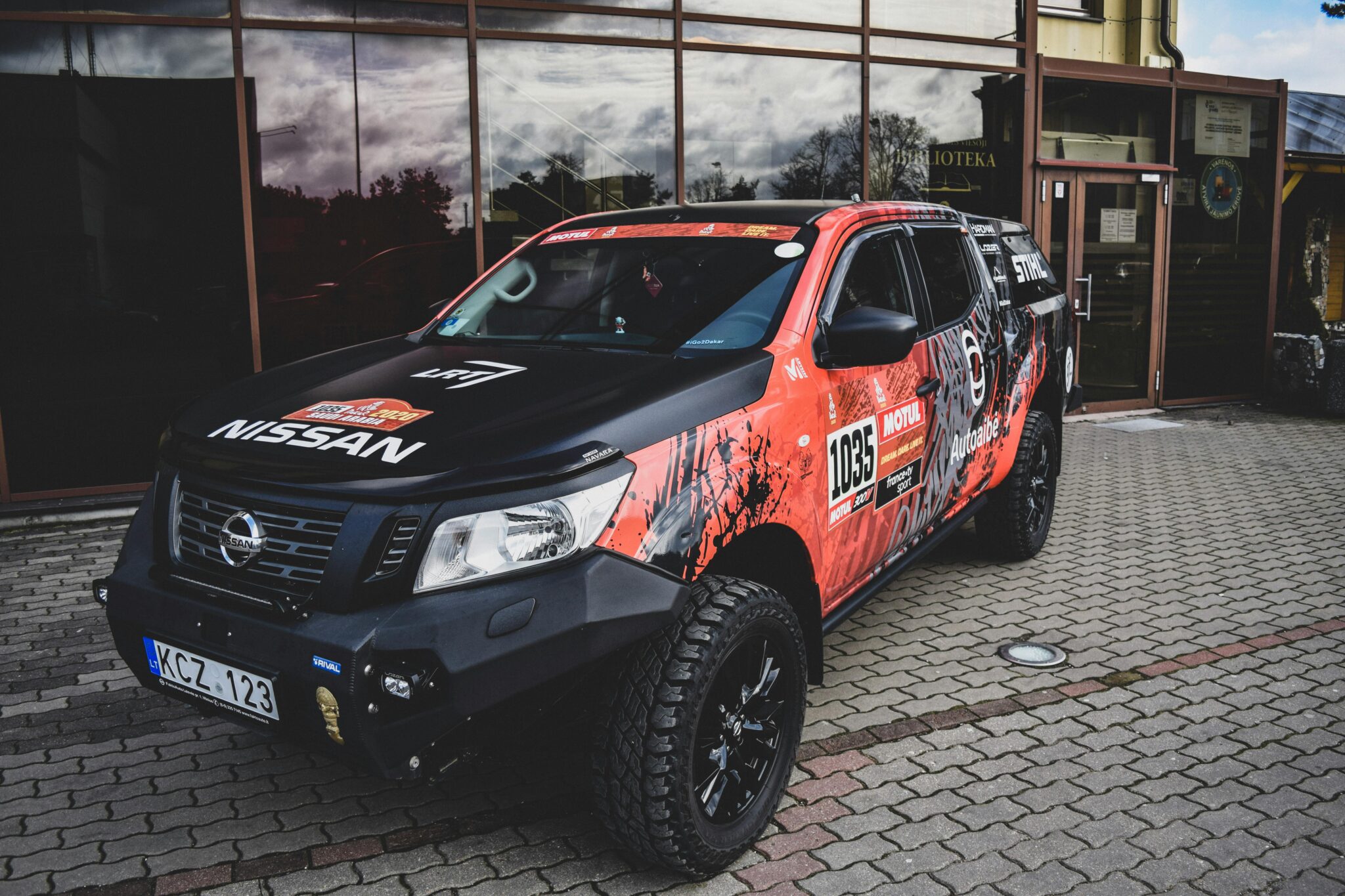 Eye-catching Nissan vehicle parked in Varėna, Lithuania, perfect for automotive photography.